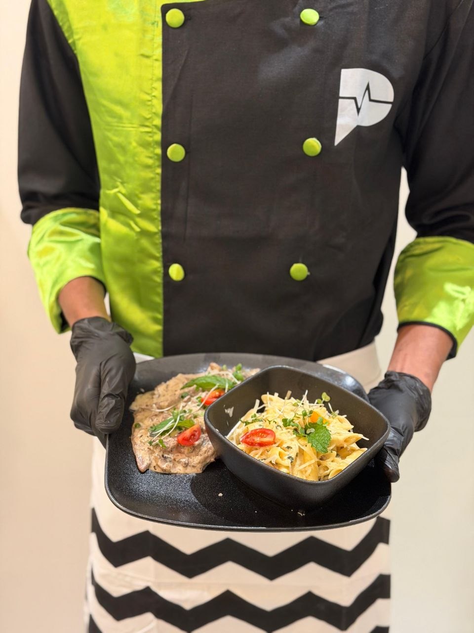 Pulse chef presenting escalope with pasta