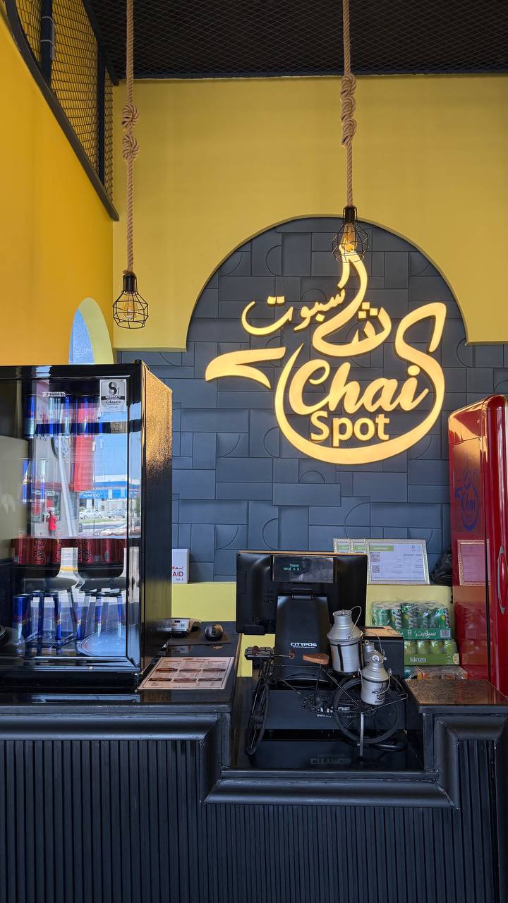 Chai Spot counter with illuminated brand sign